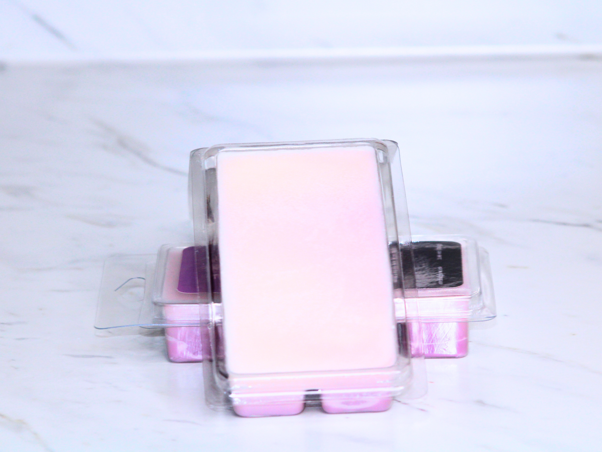 Set of clear containers on a marble surface