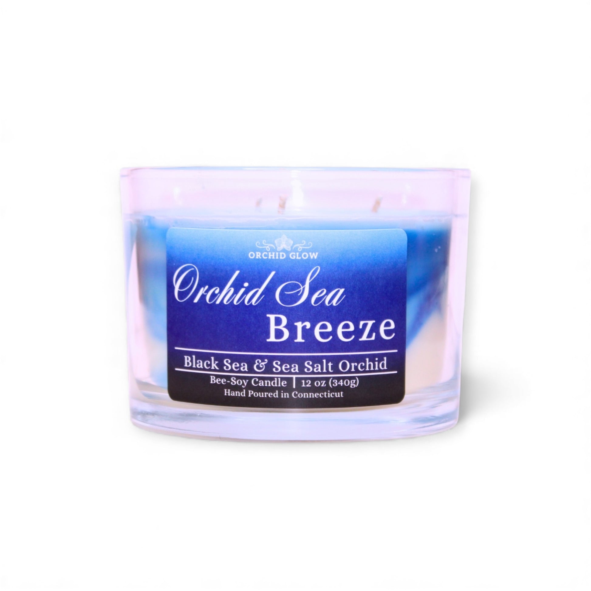 Candle labeled 'Orchid Sea Breeze' with a blue label on a white background
