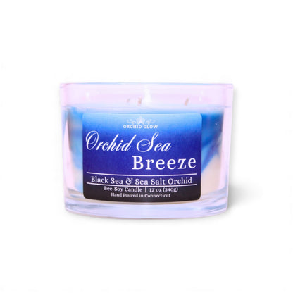 Candle labeled 'Orchid Sea Breeze' with a blue label on a white background