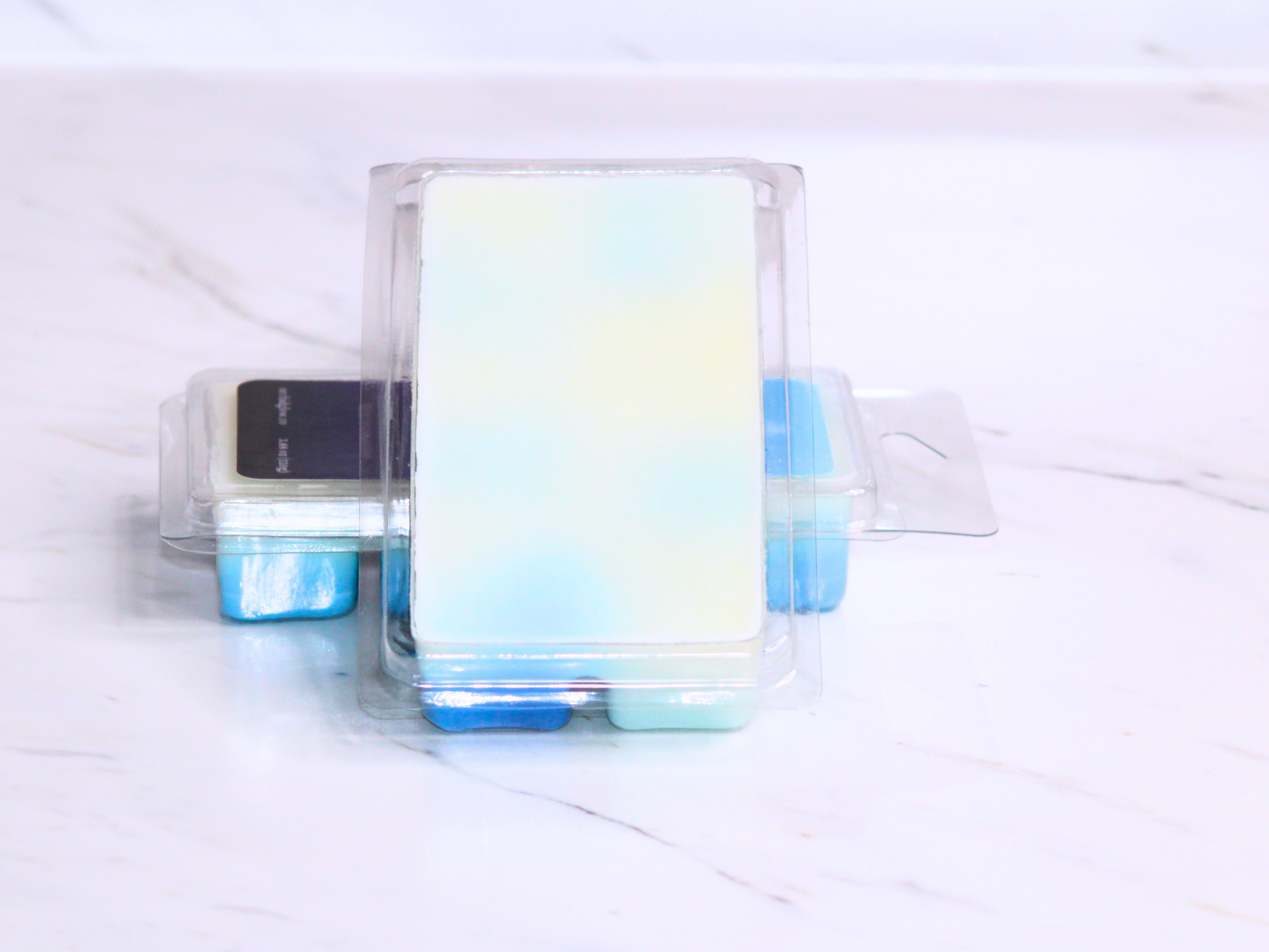 Set of clear containers on a marble surface